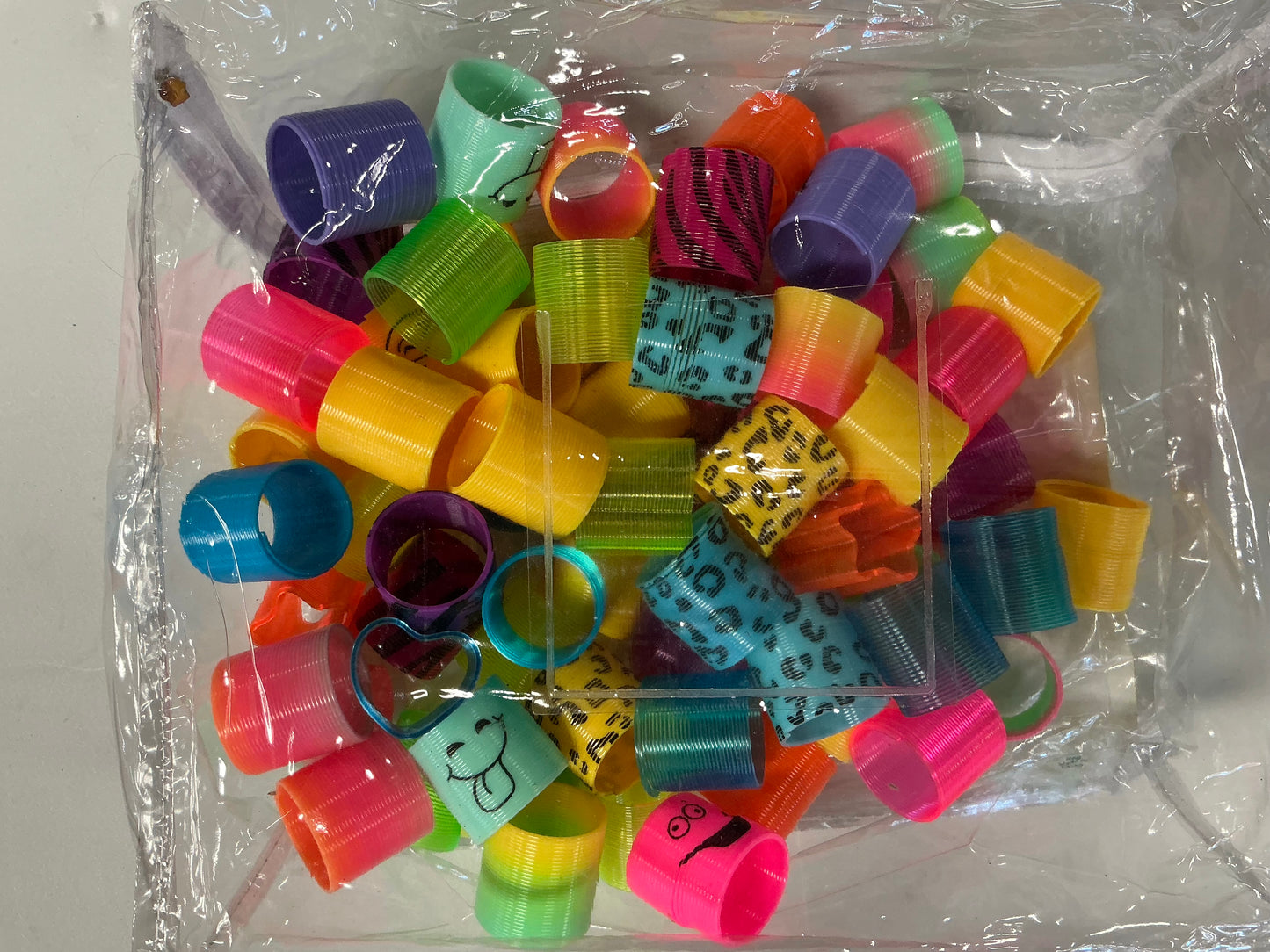Spring Toy Assortment, Pack of 69 Mini Plastic Coil Springs - Repackaged(see pictures)