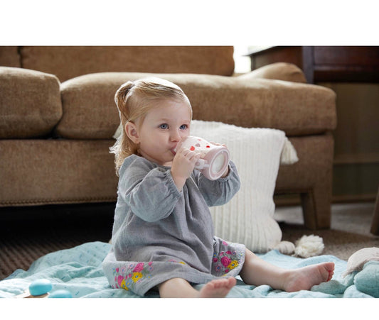 NUK Small Learner 5 oz Sippy Cup in pink with a heart pattern