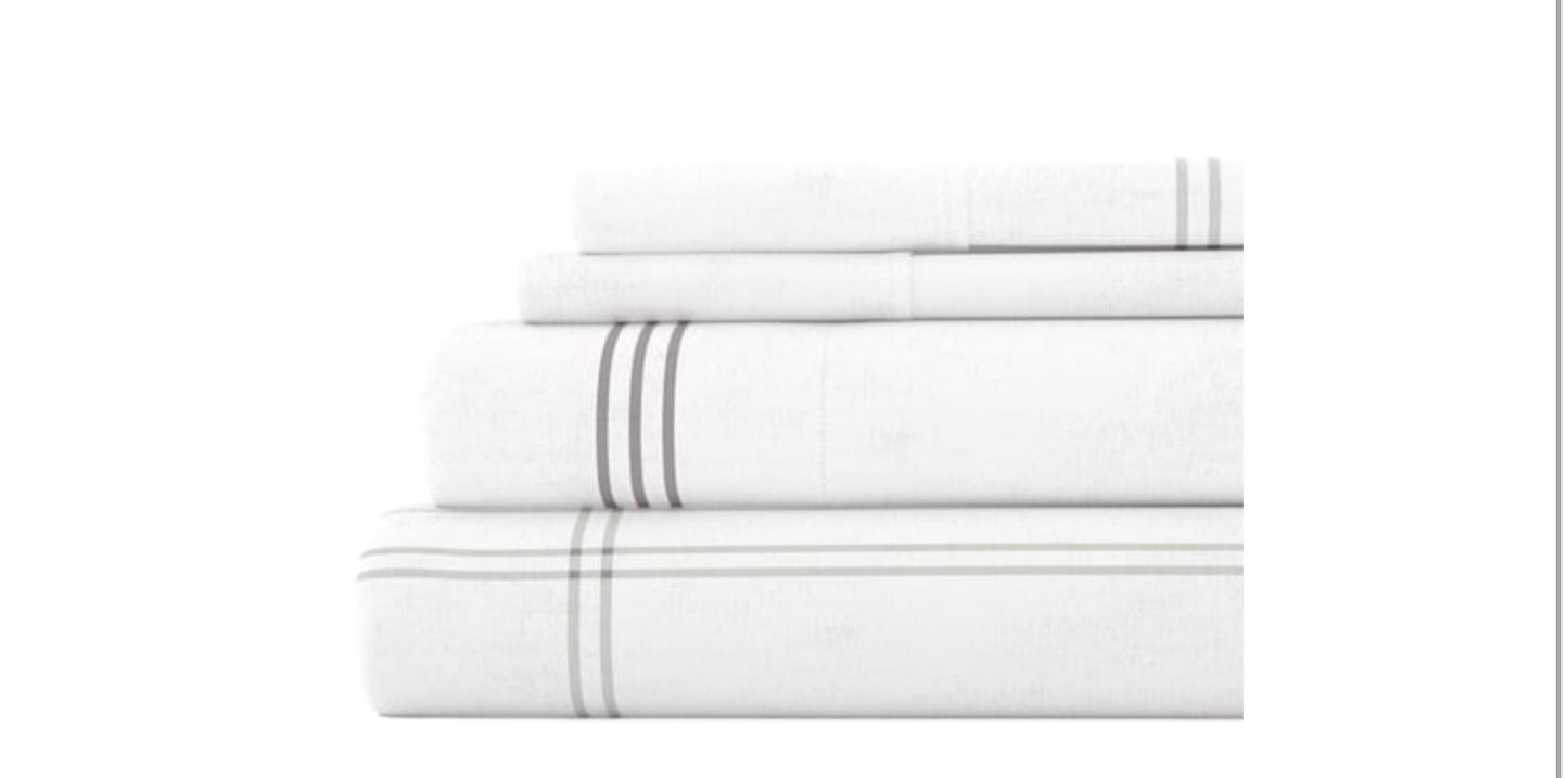 4-piece flannel sheet set for a California King bed in white with gray plaid checks