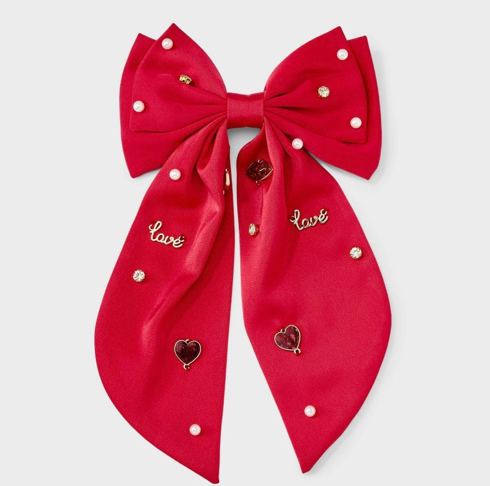 Red satin bow hair barrette adorned with pearl beads, rhinestone crystals, lips, and "love" charms