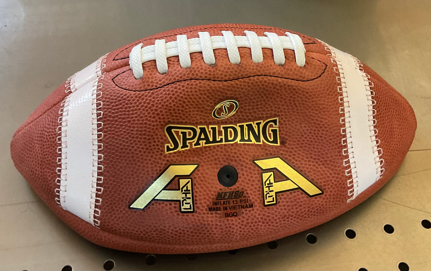 Deflated Spalding Alpha Official Full Size Leather Football