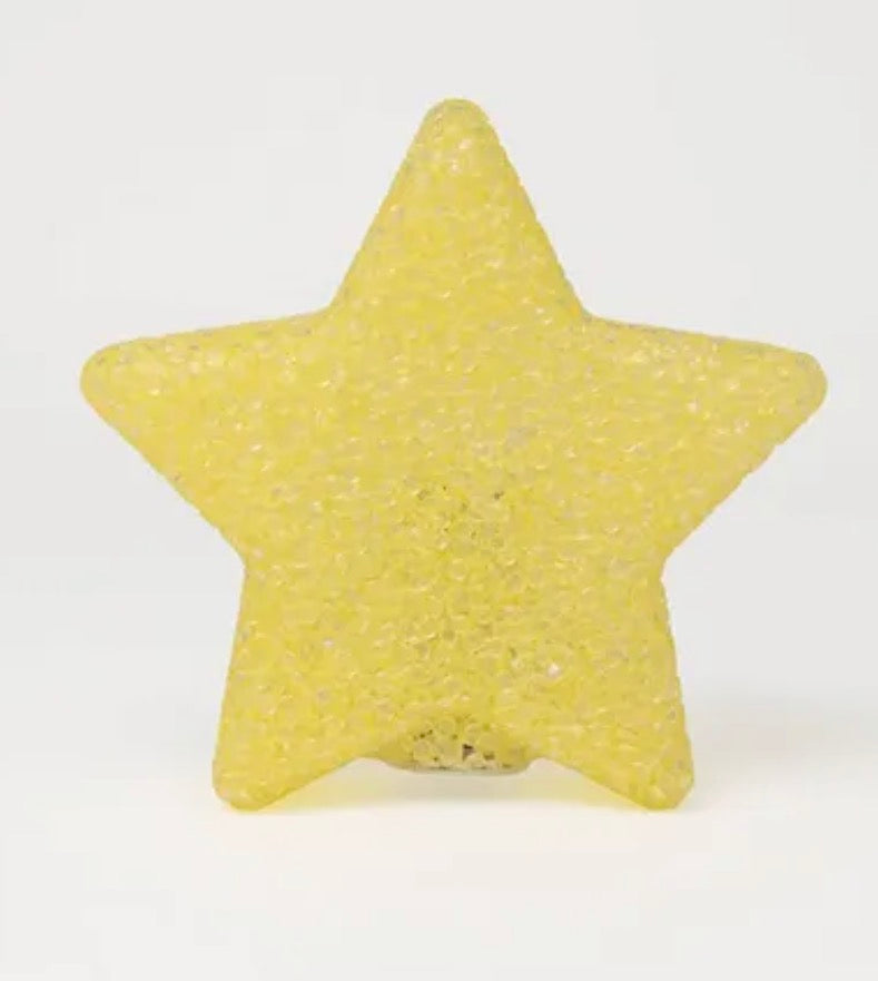 star-shaped novelty light featuring a yellow plastic textured design