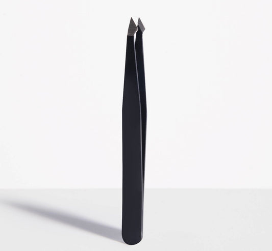 Trim Beauty Care Slant/Point Tip Tweezers made of stainless steel.