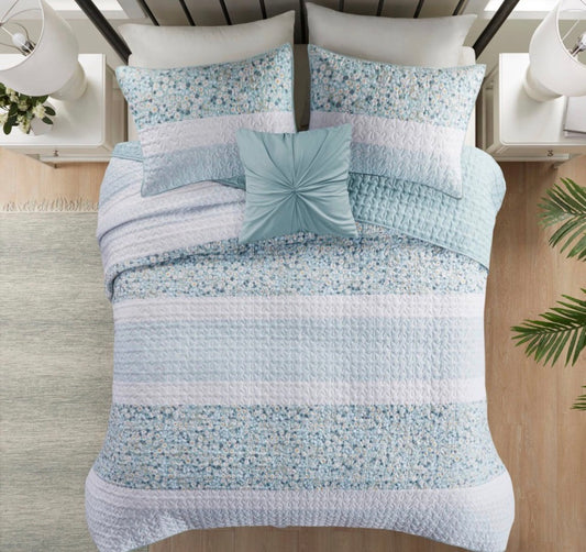 Madison Park 4-piece quilt set in a green daisy floral pattern king