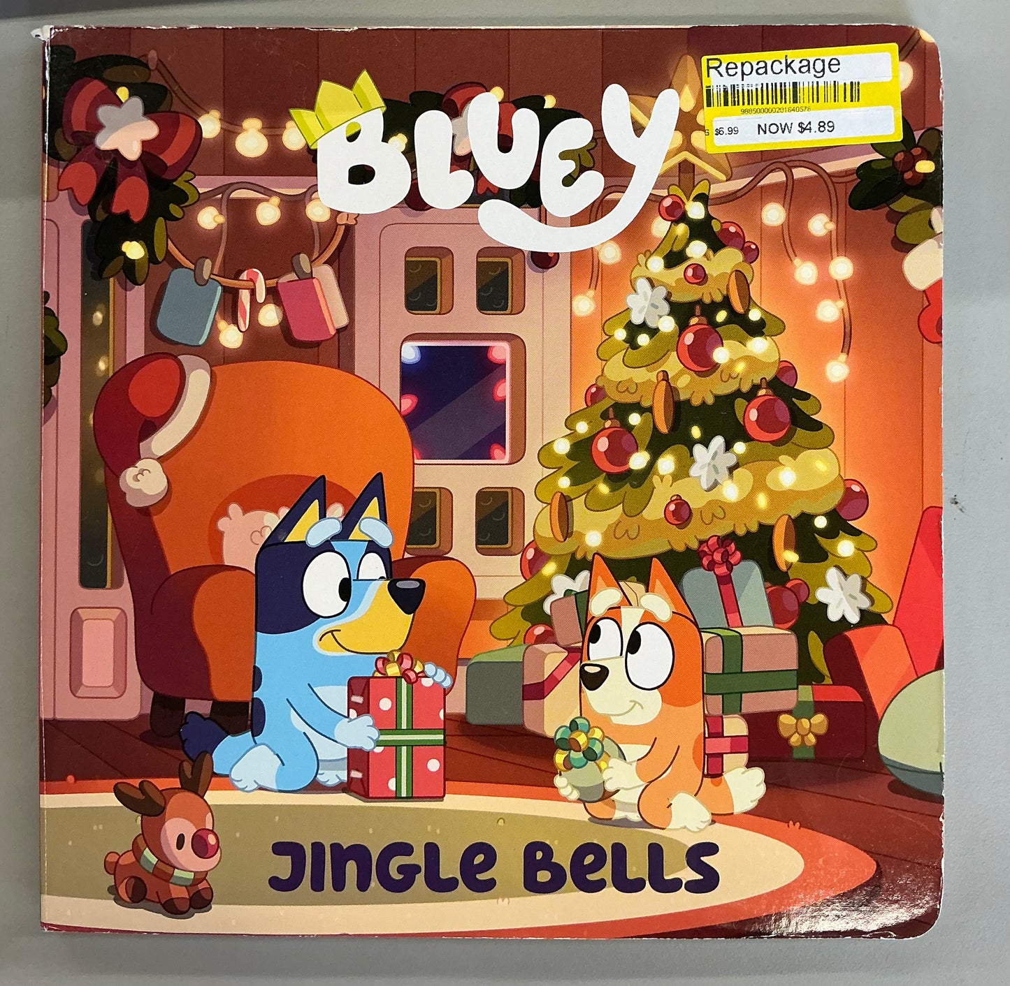 Bluey: Jingle Bells board book featuring Bluey and Bingo in a festive Christmas scene