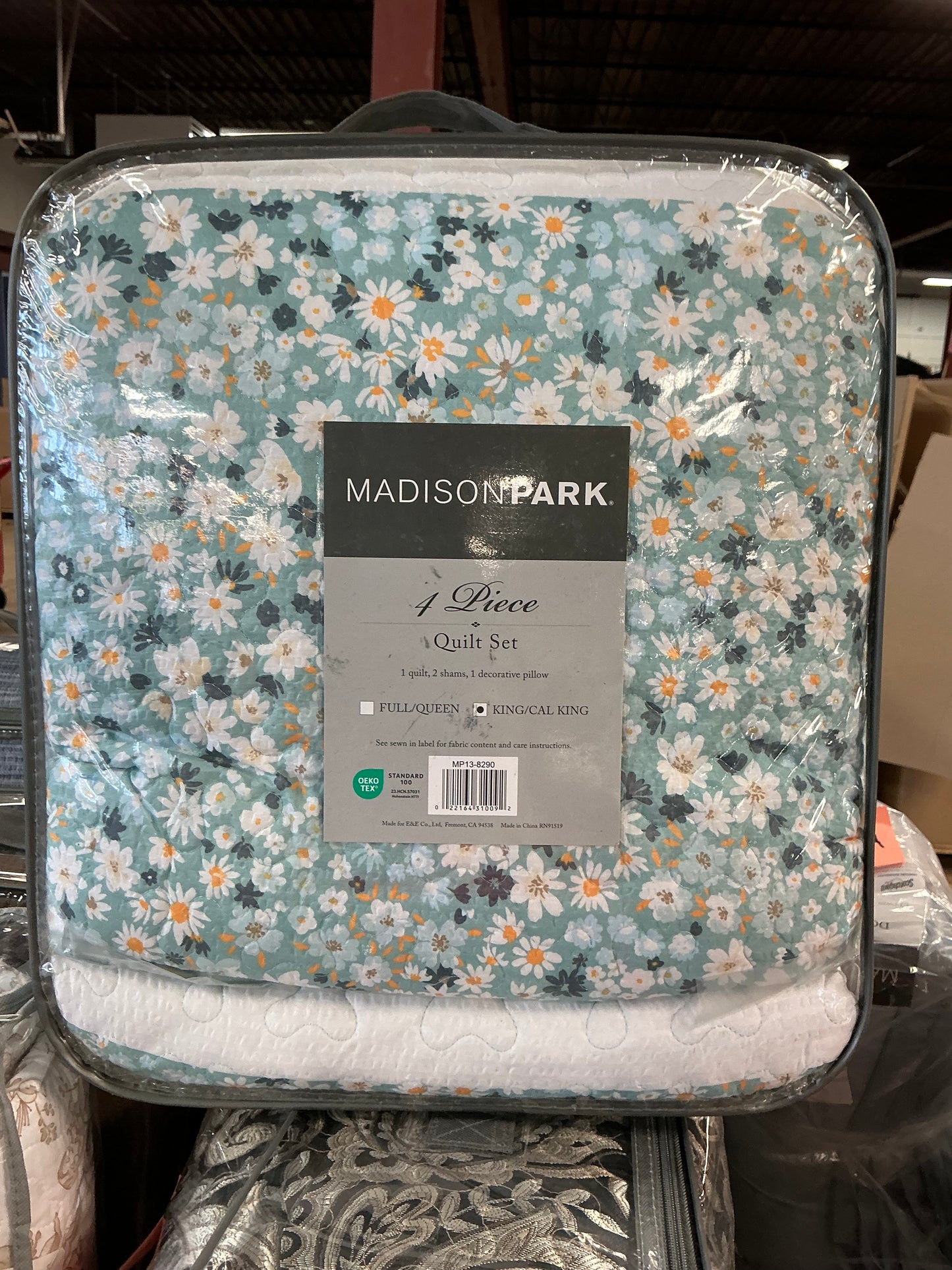 Madison Park 4-piece quilt set in a green daisy floral pattern king