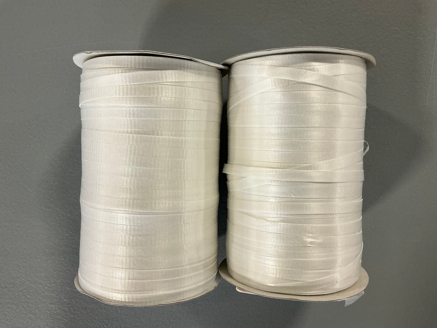 Gift Wrapping Bundle (includes 1 Tote, 1-(25sq ft)Blue Gift Wrap, 1 Clear Bow, 2 White Bows, 2 White Curling Ribbons, 2 (4 color) Curling Ribbons, 1 Curly Pink Bow, 1 (4 color) XS Gift Bags (slight damage, see picture), 1 (4 color) Small Bags)
