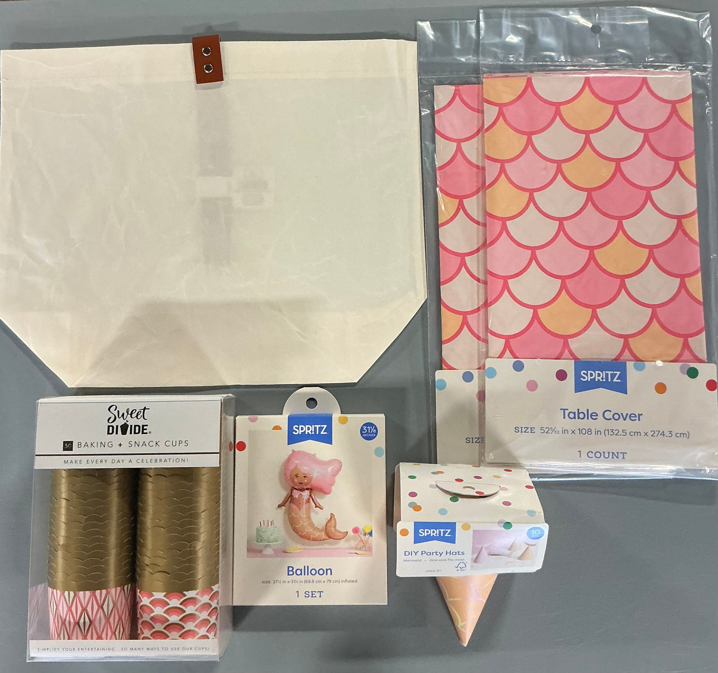 Mermaid Party Bundle - Coral Pink - (includes 2 Table Covers-25.16” X 108”, 1 Mermaid Balloon-27.5”x31.13”, 1 set of 10 party hats with 10 tails, 1 box of 50 baking & snack cups, 1 tote)