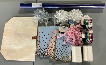 Gift Wrapping Bundle (includes 1 Tote, 1-(25sq ft)Blue Gift Wrap, 1 Clear Bow, 2 White Bows, 2 White Curling Ribbons, 2 (4 color) Curling Ribbons, 1 Curly Pink Bow, 1 (4 color) XS Gift Bags (slight damage, see picture), 1 (4 color) Small Bags)