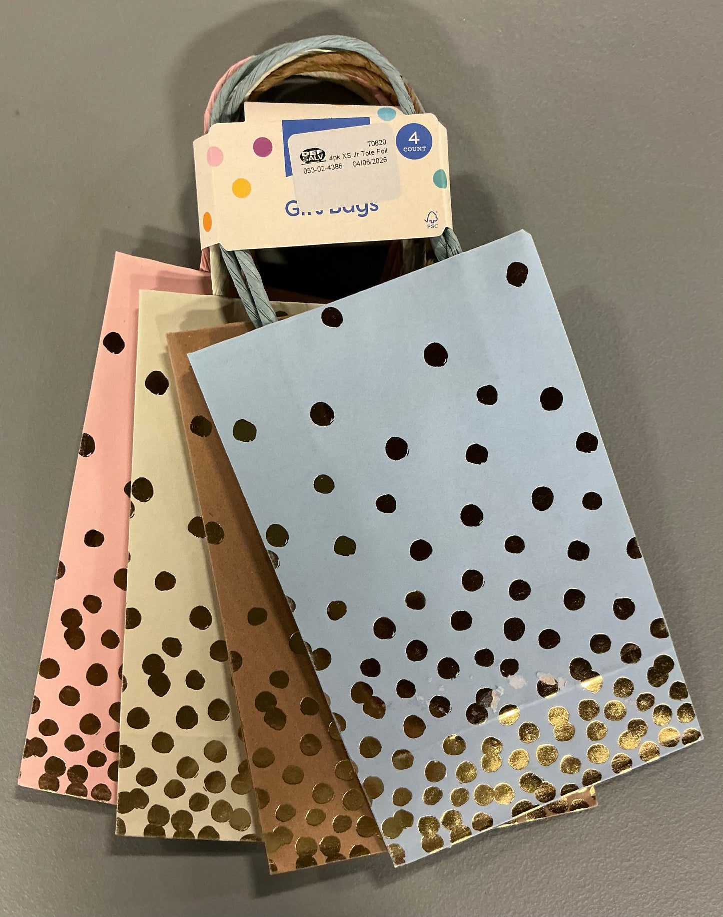 Gift Wrapping Bundle (includes 1 Tote, 1-(25sq ft)Blue Gift Wrap, 1 Clear Bow, 2 White Bows, 2 White Curling Ribbons, 2 (4 color) Curling Ribbons, 1 Curly Pink Bow, 1 (4 color) XS Gift Bags (slight damage, see picture), 1 (4 color) Small Bags)