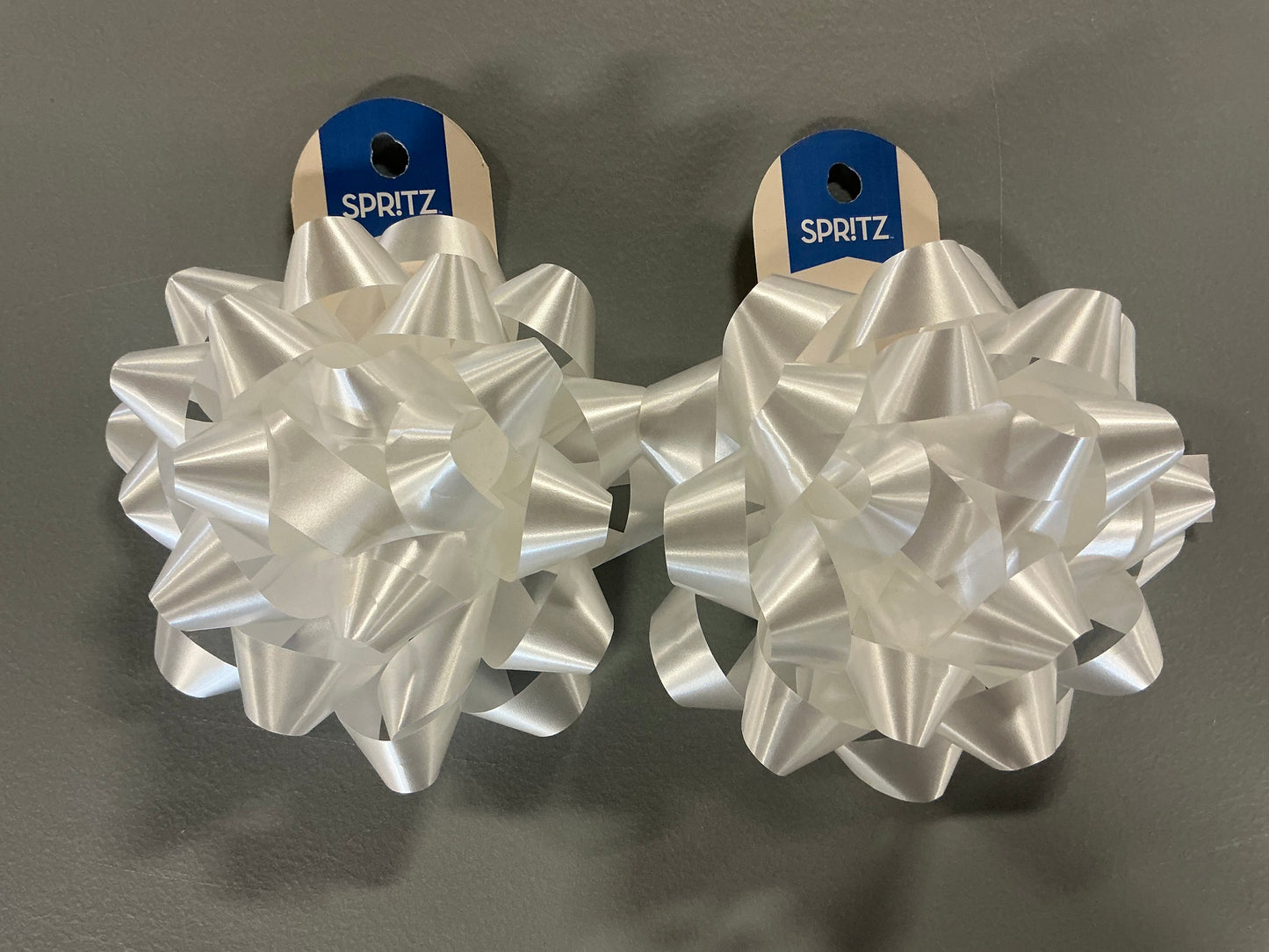 Gift Wrapping Bundle (includes 1 Tote, 1-(25sq ft)Blue Gift Wrap, 1 Clear Bow, 2 White Bows, 2 White Curling Ribbons, 2 (4 color) Curling Ribbons, 1 Curly Pink Bow, 1 (4 color) XS Gift Bags (slight damage, see picture), 1 (4 color) Small Bags)