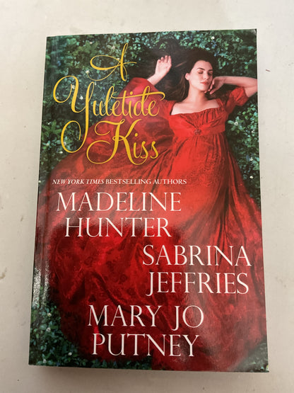 A Yuletide Kiss - by Madeline Hunter & Sabrina Jeffries & Mary Jo Putney (Paperback)