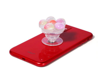 Vivitar Twist n' Hold floral phone grip and stand in a glittery pink and white design.