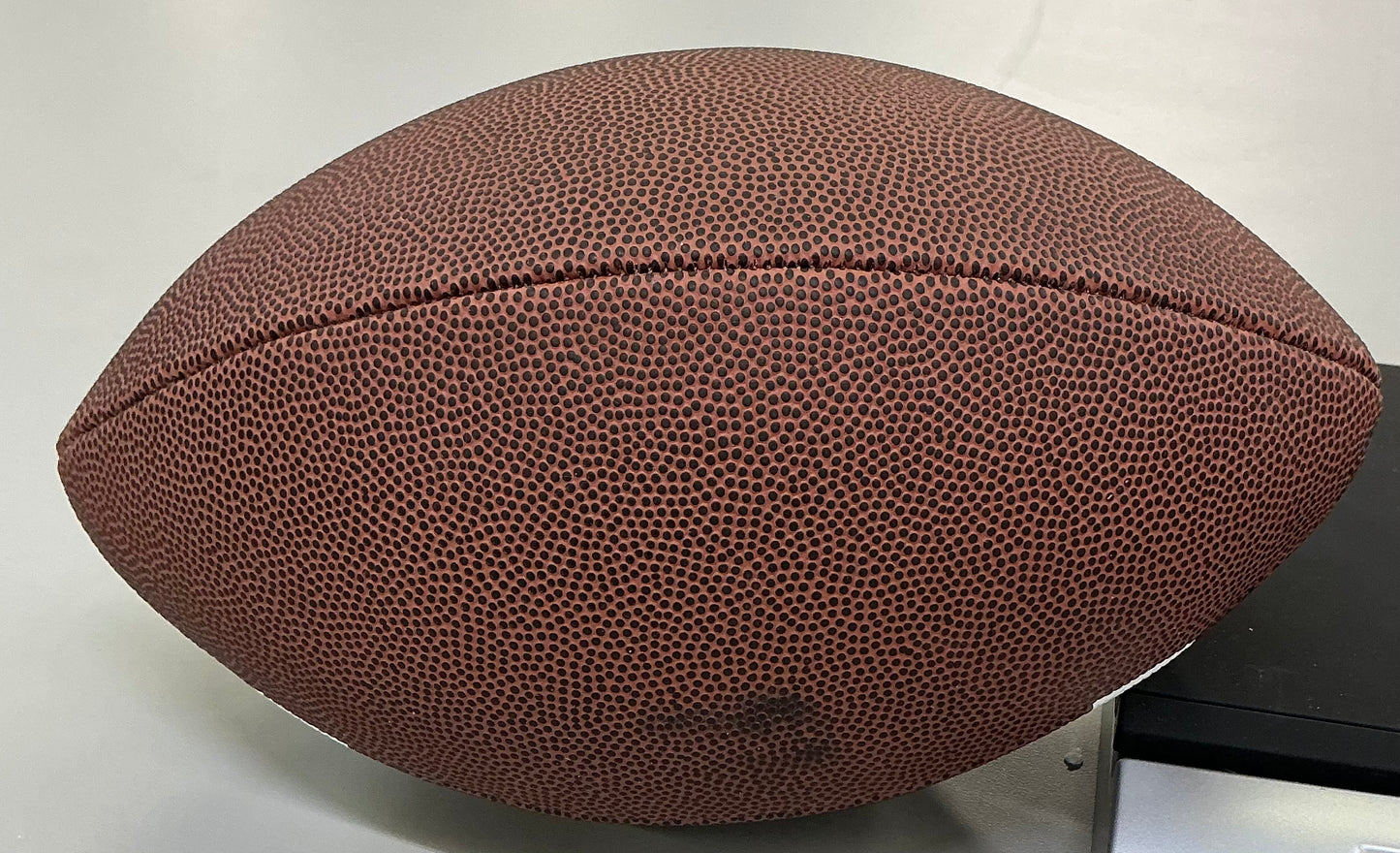 Wilson NCAA junior size football statement series - SOME MINOR COSMETIC FLAWS