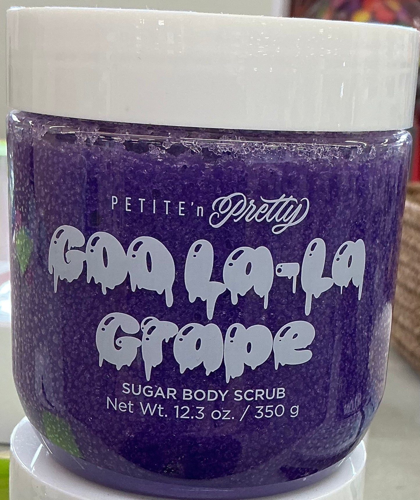 Petite 'n Pretty Goo La-La Grape Sugar Body Scrub in a purple 12.3 oz container.