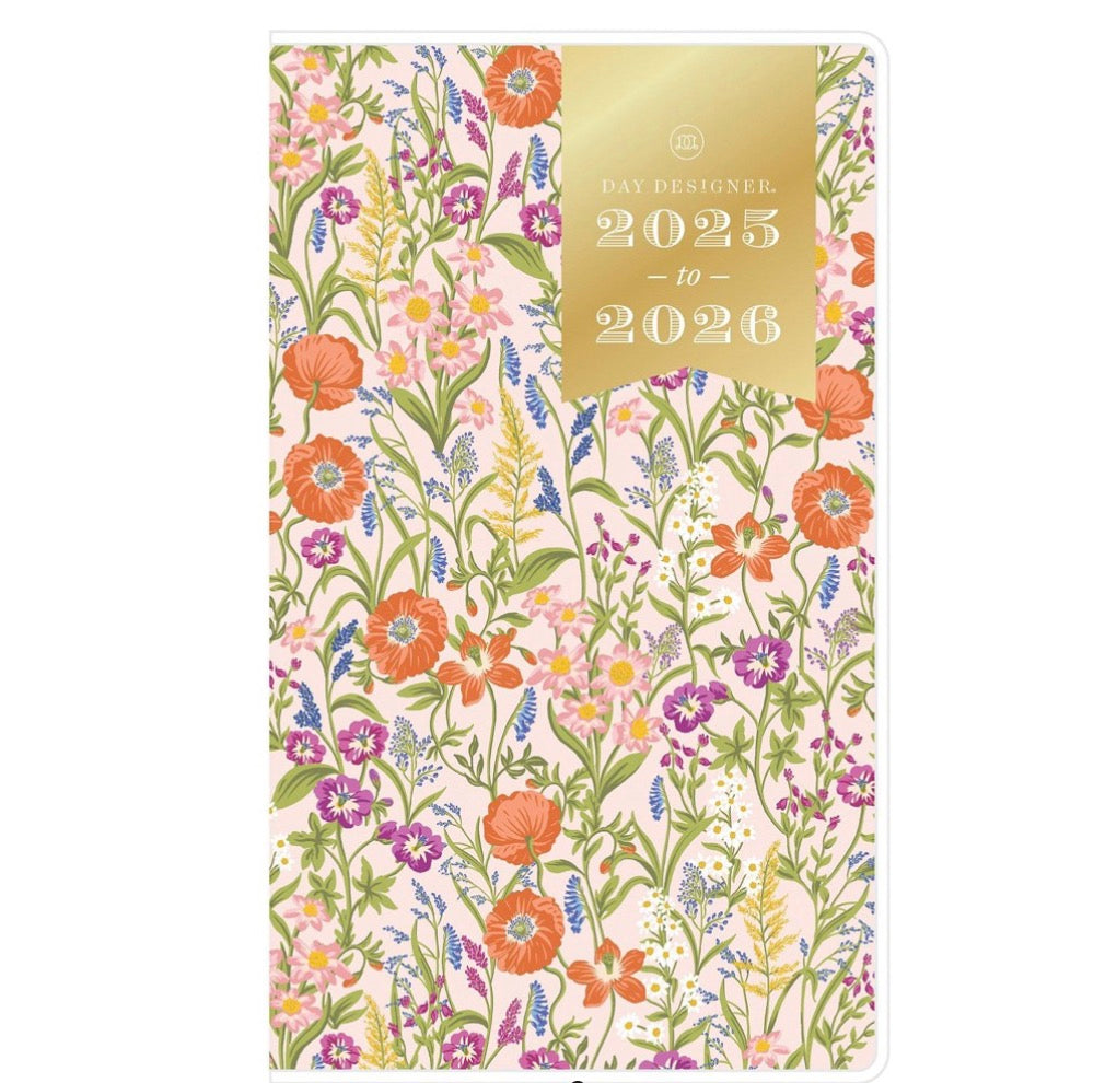 Day Designer 2025-2026 planner featuring a floral pattern with a gold foil label.
