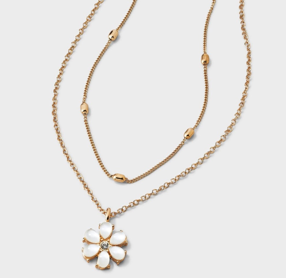 Rose gold tone Wild Fable layered necklace featuring delicate chains with small bead accents and a flower pendant