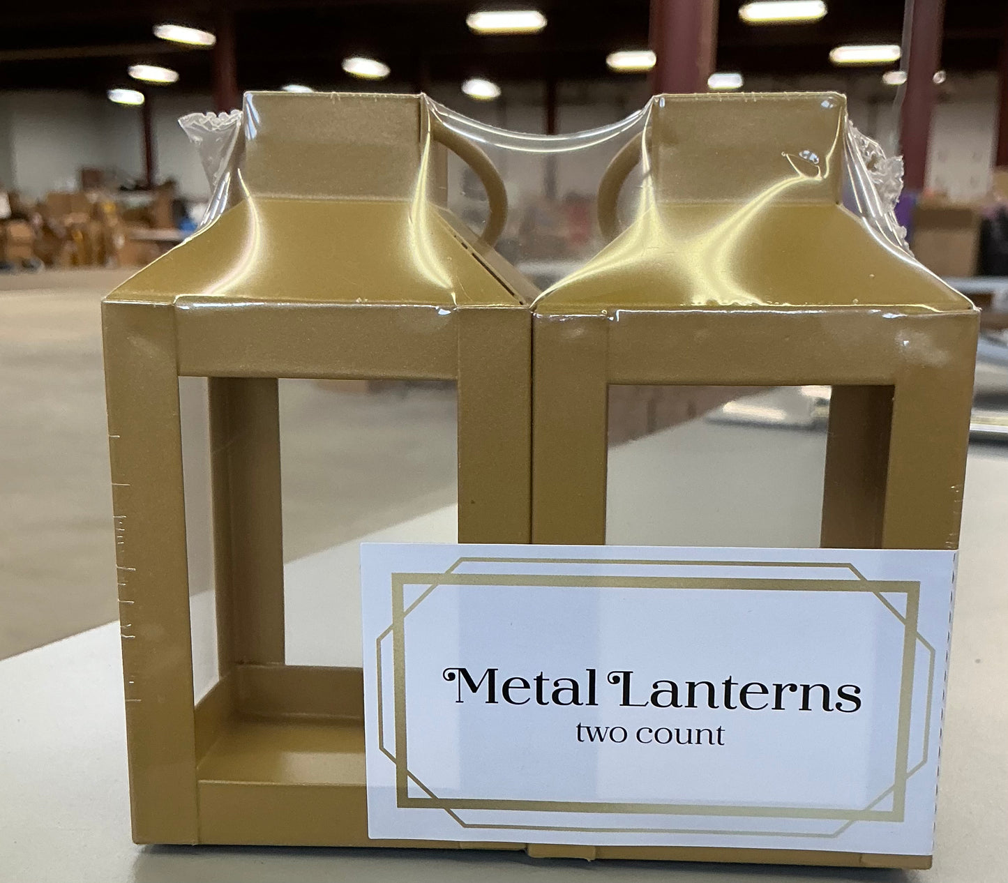 Set of two gold-colored metal lanterns