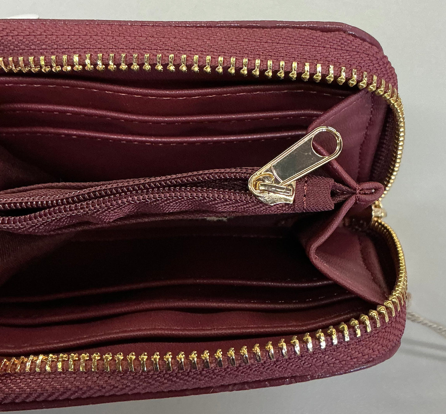 A New Day brand faux crocodile embossed wine-red zip-around wallets