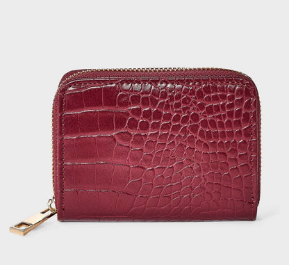 A New Day brand faux crocodile embossed wine-red zip-around wallets