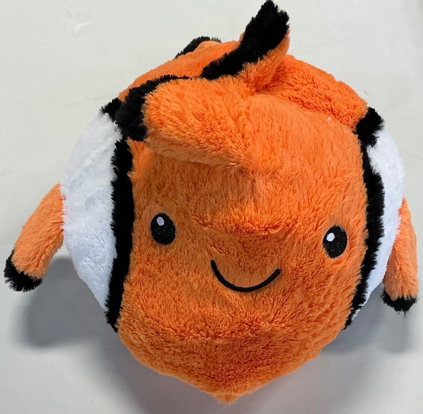 Hug Me reversible flip plush featuring a red crab that reverses into a clownfish