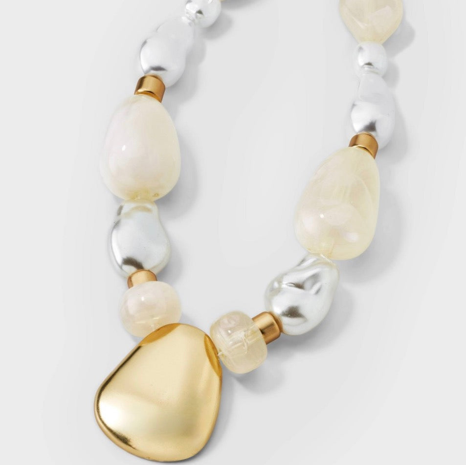 Beaded pendant necklace featuring white faux pearls and a matte gold-tone pendant-As Is