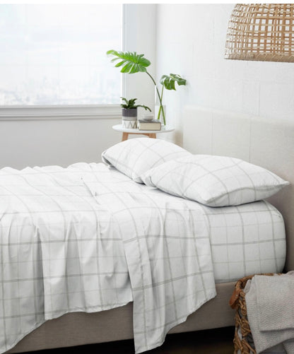 4-piece flannel sheet set for a California King bed in white with gray plaid checks