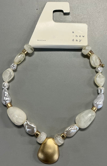 Beaded pendant necklace featuring white faux pearls and a matte gold-tone pendant-As Is