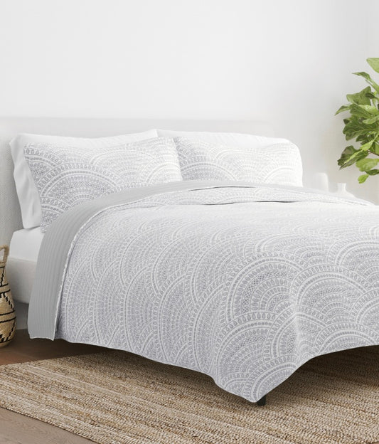 White, 3-piece reversible quilted bed set featuring a gray geometric leaf pattern