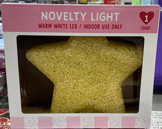 star-shaped novelty light featuring a yellow plastic textured design