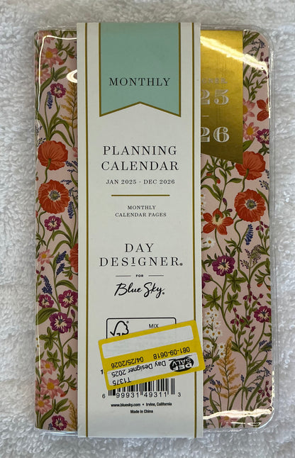 Day Designer 2025-2026 planner featuring a floral pattern with a gold foil label.