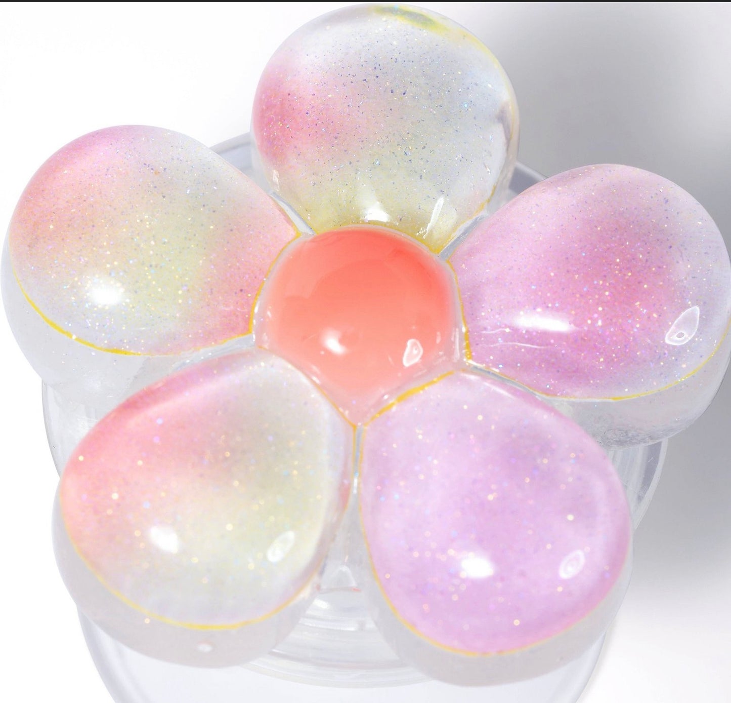 Vivitar Twist n' Hold floral phone grip and stand in a glittery pink and white design.
