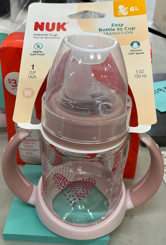 NUK Small Learner 5 oz Sippy Cup in pink with a heart pattern