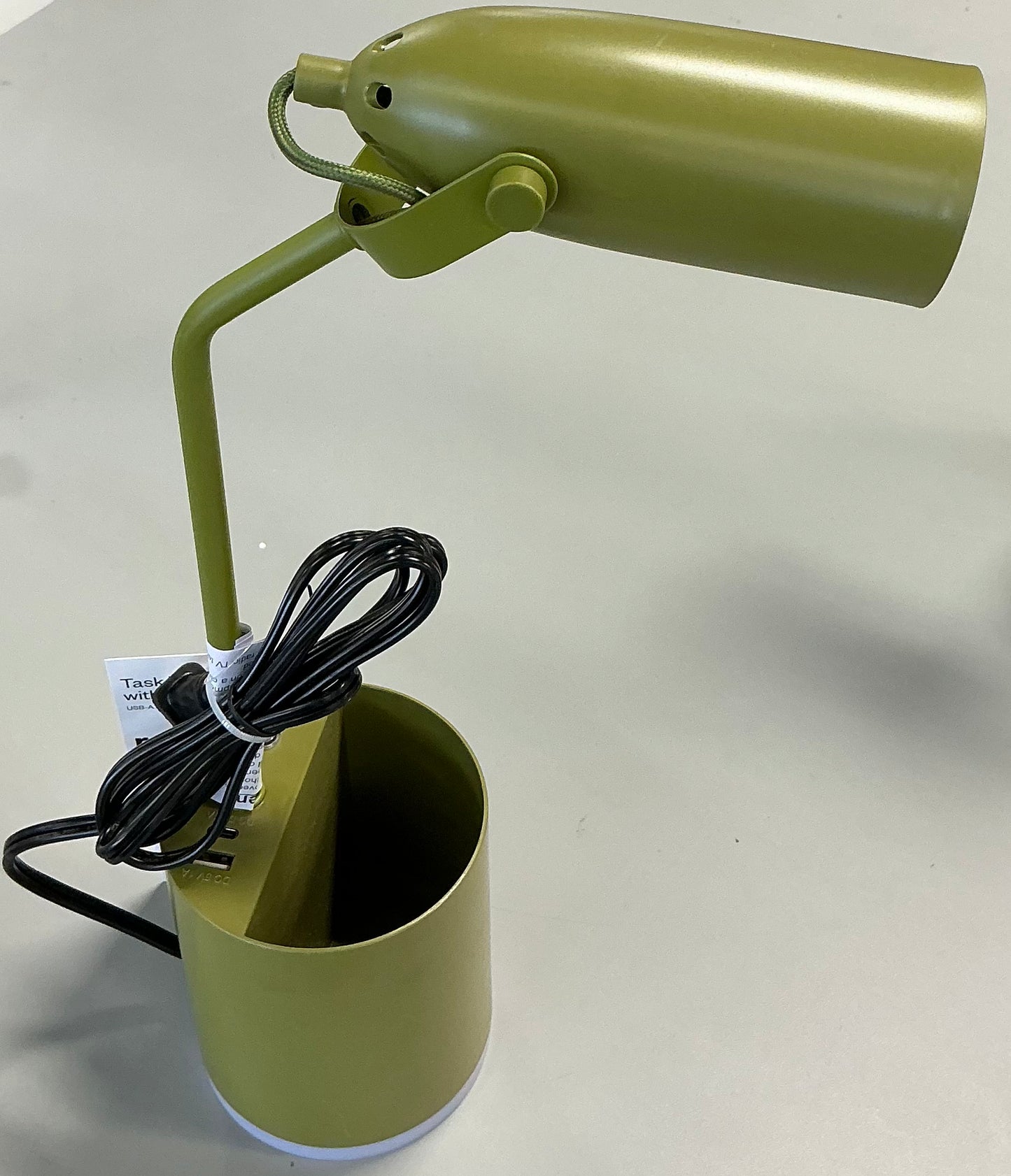 Olive green task table lamp with an integrated LED bulb, a pen holder base, and USB charging ports