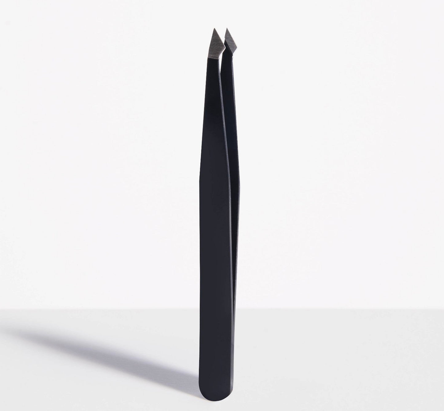 Trim Beauty Care Slant/Point Tip Tweezers made of stainless steel.