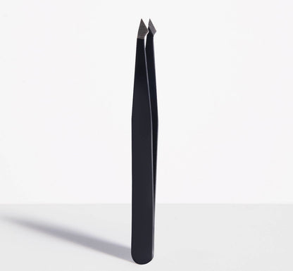 Trim Beauty Care Slant/Point Tip Tweezers made of stainless steel.