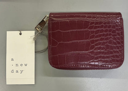 A New Day brand faux crocodile embossed wine-red zip-around wallets