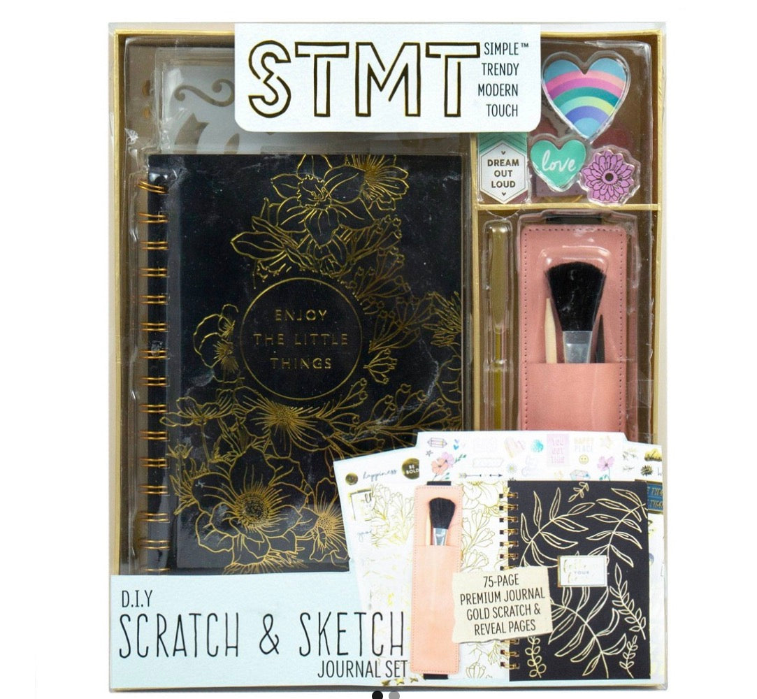 STMT DIY Scratch & Sketch Journal Set featuring a black journal with gold floral accents.