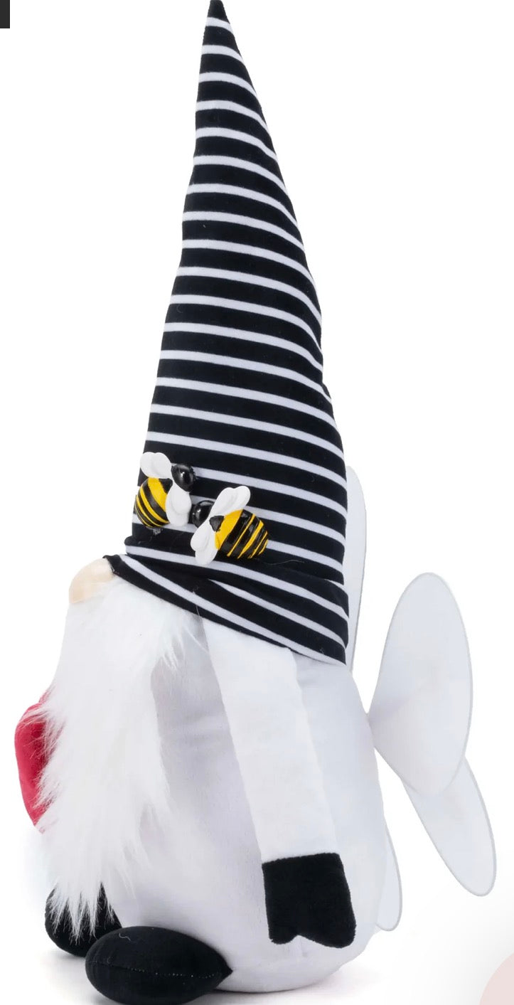 Rae Dunn Valentine's Day plush gnome featuring a black and white striped hat with bees and holding a red heart embroidered with "BEE MINE"