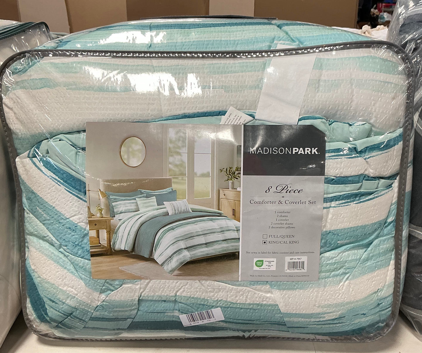 Madison Park Marina 8-piece printed seersucker comforter and coverlet set in a blue and white striped colorway king/cal king