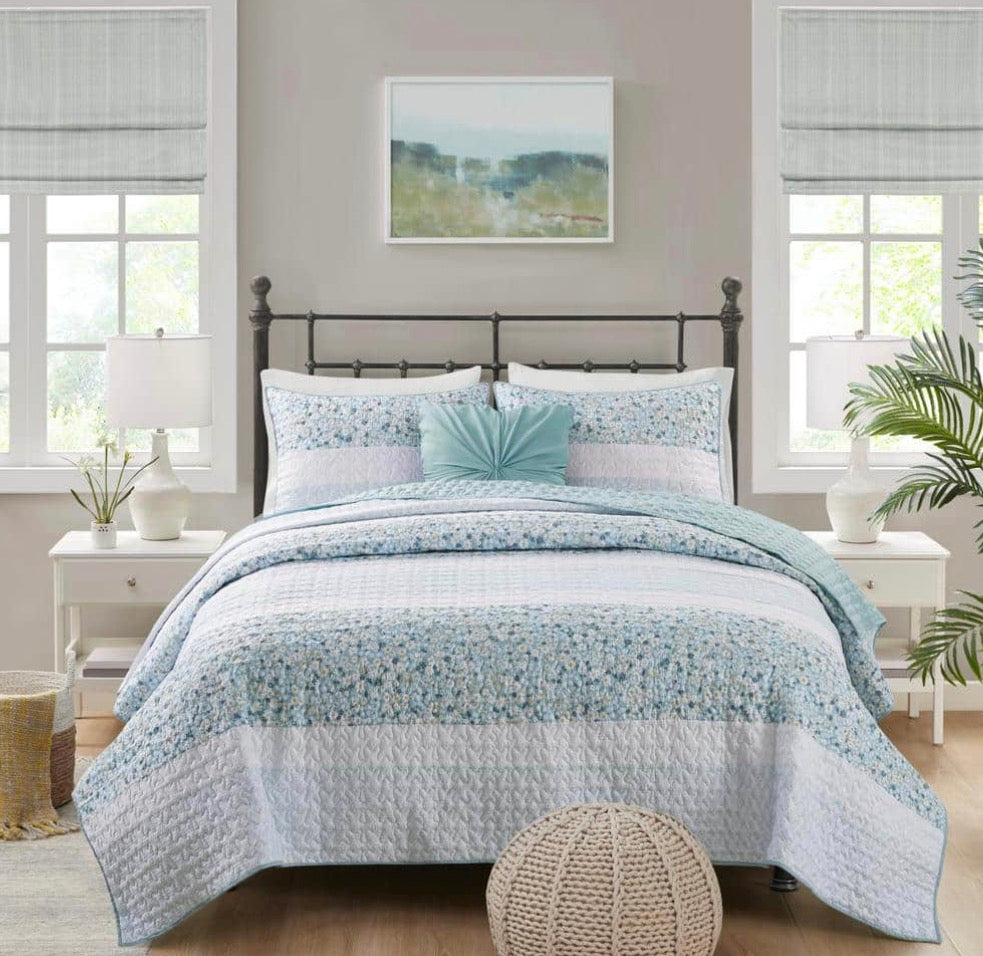 Madison Park 4-piece quilt set in a green daisy floral pattern king