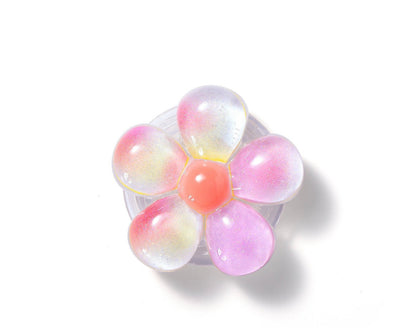 Vivitar Twist n' Hold floral phone grip and stand in a glittery pink and white design.