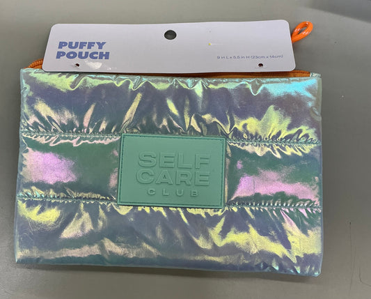 Iridescent puffer pouch featuring a "Self Care Club" patch
