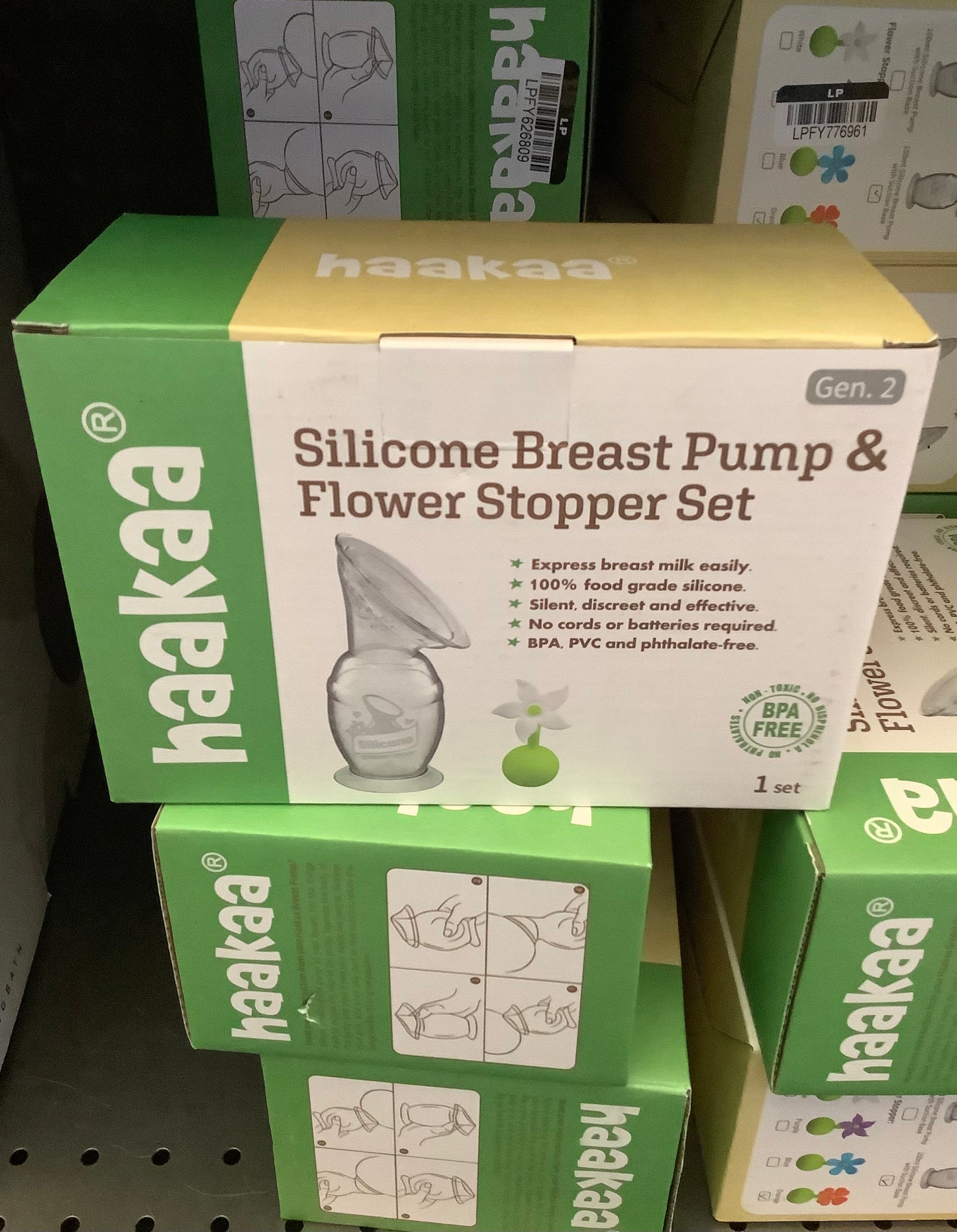 haakaa Breast Pump with Suction Base and Orange Flower Stopper - 5oz