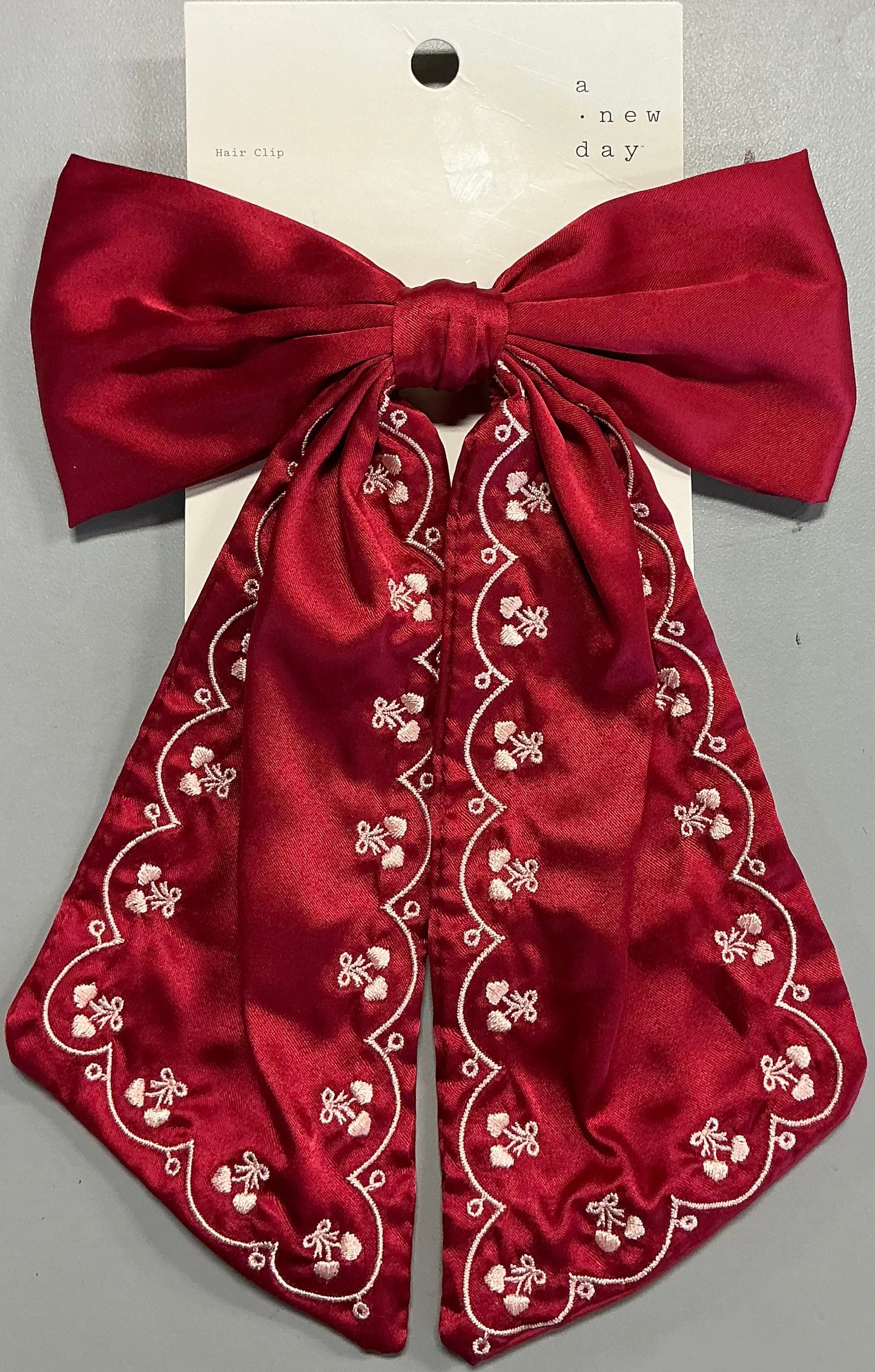 Satin hair bow with hearts embroidery