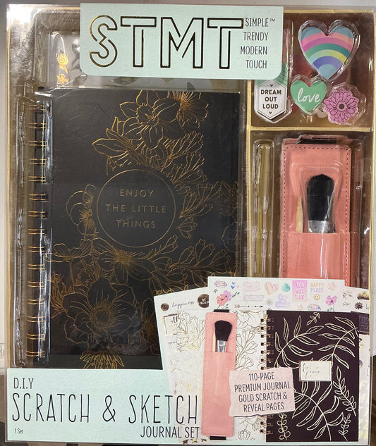 STMT DIY Scratch & Sketch Journal Set featuring a black journal with gold floral accents.
