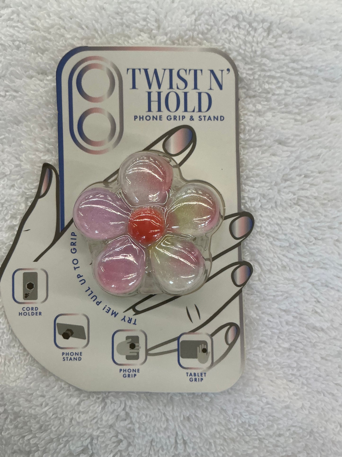 Vivitar Twist n' Hold floral phone grip and stand in a glittery pink and white design.