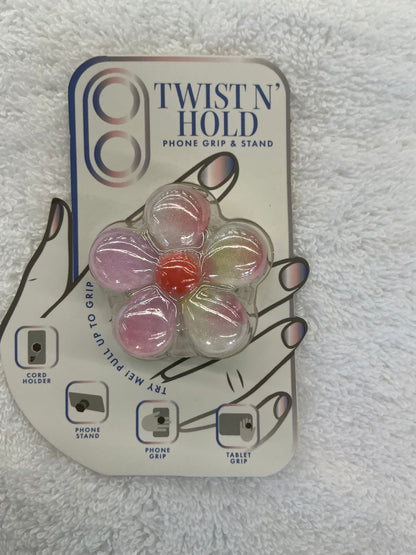 Vivitar Twist n' Hold floral phone grip and stand in a glittery pink and white design.